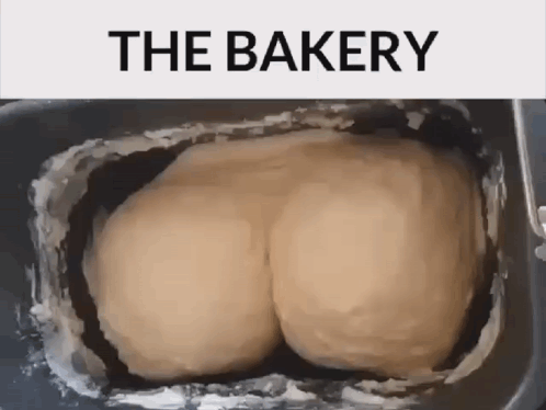 A Bunch Of Dough In A Pan That Says The Bakery On The Top GIF