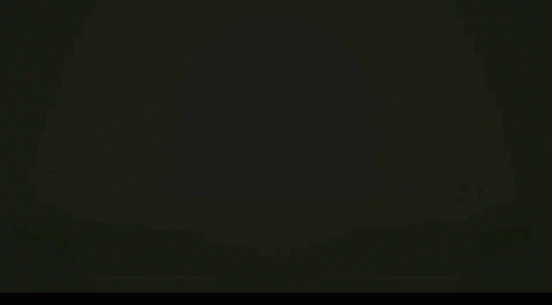 A Bunch Of Green Beans Are Falling On A Green Background . GIF
