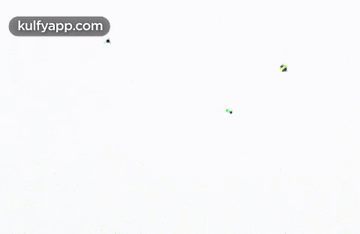 A Bunch Of Kites Are Flying On A White Background GIF