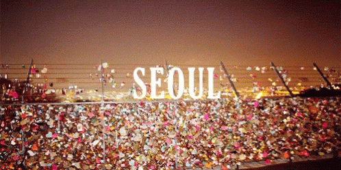A Bunch Of Locks On A Fence With The Word Seoul On It GIF