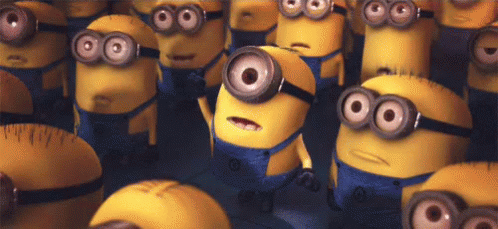 A Bunch Of Minions With Big Eyes Are Standing Next To Each Other . GIF