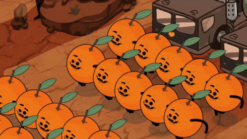 a bunch of oranges with faces on them are lined up