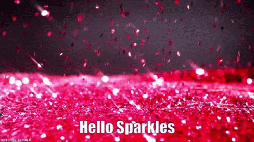 A Bunch Of Pink Glitter Is Falling On A Red Surface . GIF