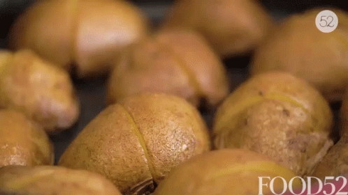 A Bunch Of Potatoes In A Pan With The Words Food52 On The Bottom Right GIF