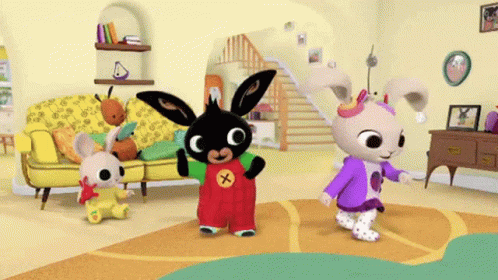 A Bunch Of Rabbits Are Dancing In A Living Room With A Yellow Couch GIF