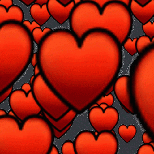 a bunch of red hearts on a dark background