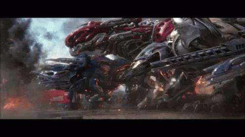a bunch of robots are fighting each other with smoke coming out of them