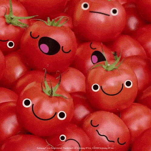 A Bunch Of Tomatoes With Faces On Them GIF
