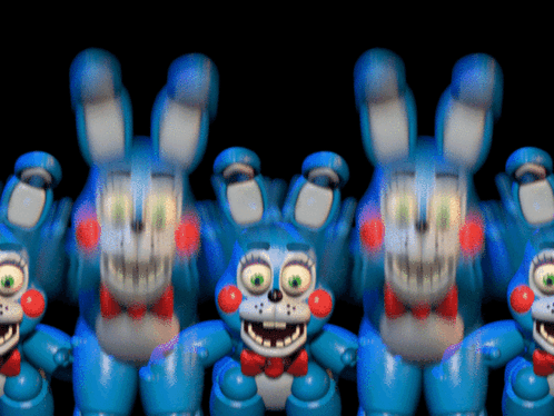 A Bunch Of Toy Bonnie Rabbits Are Standing In A Line GIF