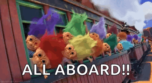 A Bunch Of Trolls Are Sitting On A Train With The Words `` All Aboard '' Written On It . GIF