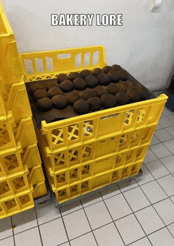 A Bunch Of Yellow Crates With The Words Bakery Lore On The Bottom GIF