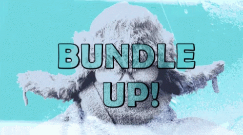 A Bundle Up Sign With A Statue Of A Person In The Background GIF