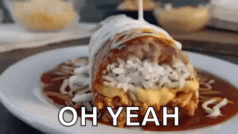 A Burrito On A Plate With The Words Oh Yeah On It . GIF