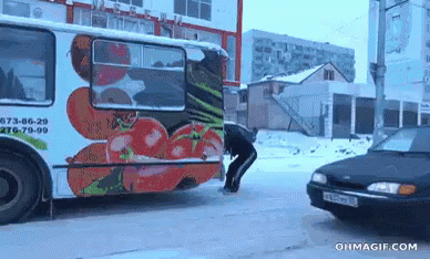 A Bus With A Picture Of Tomatoes On The Side GIF