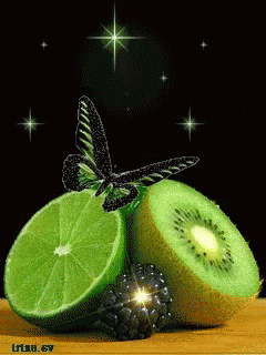 A Butterfly Is Sitting On A Slice Of Lime And Kiwi GIF