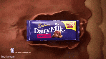 A Cadbury Dairy Milk Bar With A Teddy Bear On The Front GIF