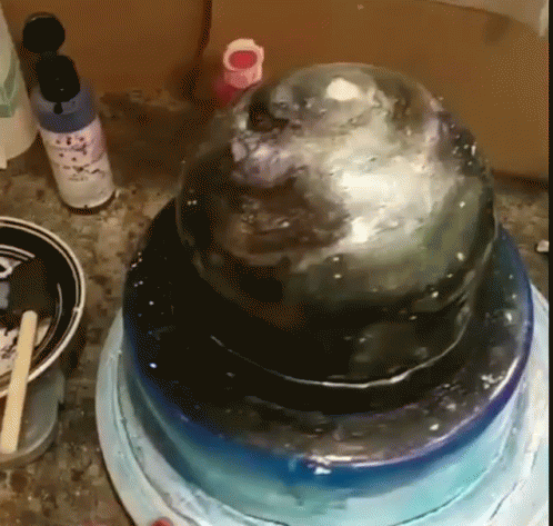 A Cake Is Sitting On Top Of A Blue Plate GIF
