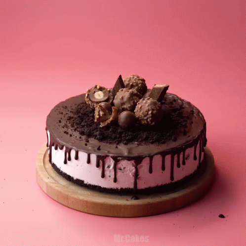 a cake on a wooden cutting board that says mr.cakes on it