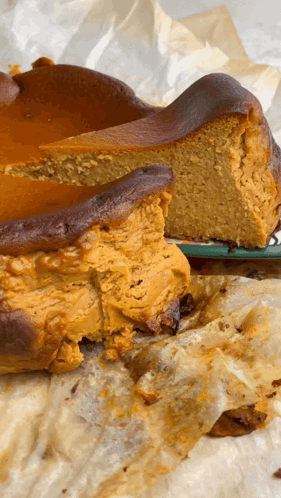 A Cake With A Slice Taken Out Of It On A Plate GIF