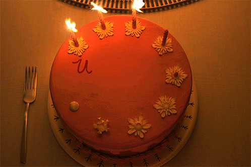 a cake with candles on it and the word we written on it