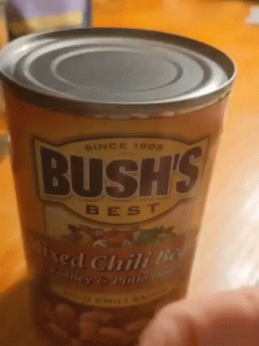 A Can Of Bush 'S Best Mixed Chili Beans Is On A Table GIF