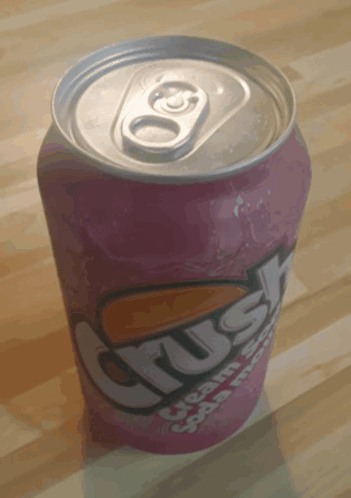 A Can Of Crush Cream Soda Sits On A Wooden Surface GIF