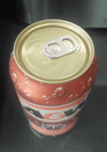 A Can Of Soda With The Top Open And The Number 80 On It GIF