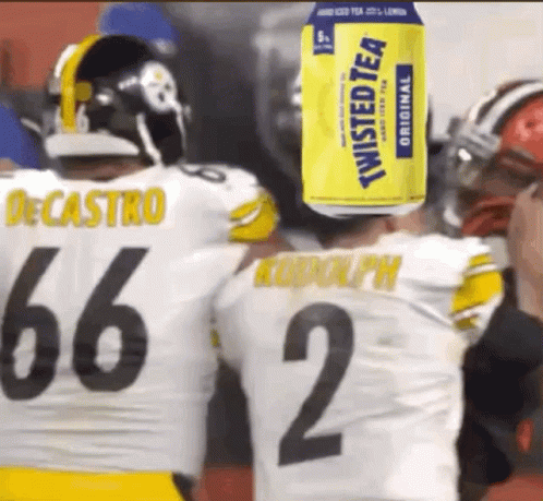 A Can Of Twisted Tea Is On The Head Of A Football Player GIF