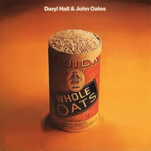 A Can Of Whole Oats Sits On An Orange Surface GIF