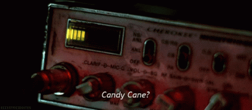 A Candy Cane Sign Is Displayed On A Radio GIF