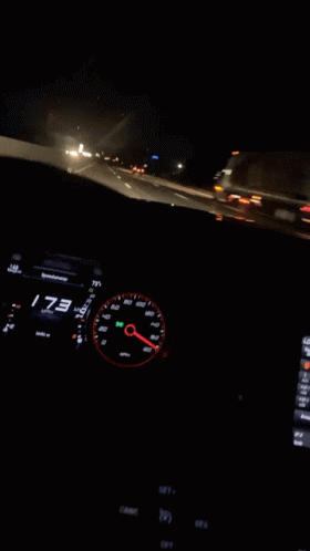 a car dashboard with a speedometer reading 173