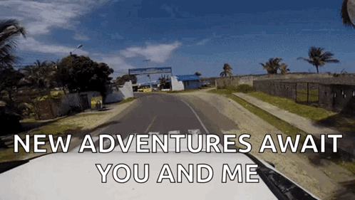 A Car Driving Down A Road With The Words " New Adventures Await You And Me " GIF