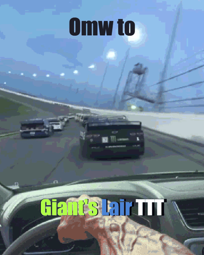 A Car Driving Down A Road With The Words Omw To Giant 'S Lair Ttt On The Dashboard GIF