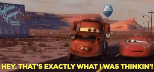A Car From The Movie Cars Is Driving Down A Road With A Balloon Flying In The Background . GIF