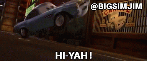 a car from the movie cars says hi-yah in front of a garage
