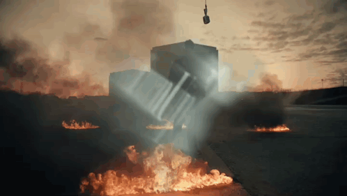 A Car Is Being Lifted Into The Air By A Crane GIF
