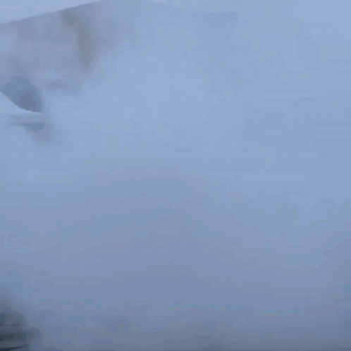 A Car Is Doing A Burnout In A Parking Lot With Smoke Coming Out Of It GIF