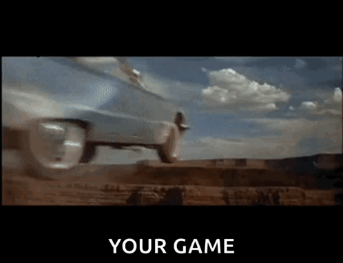 A Car Is Driving Down A Dirt Road And The Words " Your Game " Are On The Screen GIF