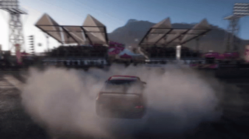 A Car Is Driving Down A Dirt Road With Smoke Coming Out Of It GIF