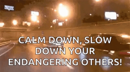 A Car Is Driving Down A Highway At Night And Says Calm Down Slow Down Your Endangering Others . GIF