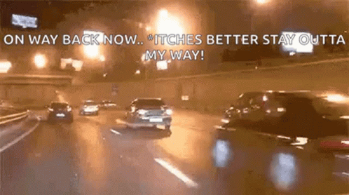 a car is driving down a highway at night with the words `` on way back now ... itches better stay outta my way '' .