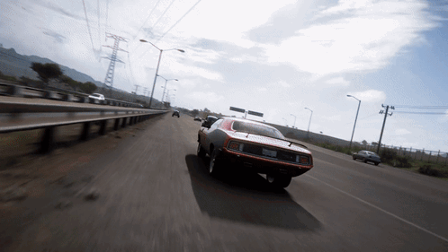 A Car Is Driving Down A Highway With A License Plate That Says ' Sd ' On It GIF