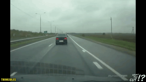 A Car Is Driving Down A Highway With The Words What The Cut On The Bottom Right GIF