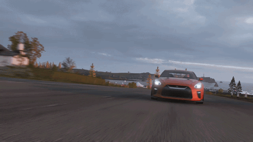 A Car Is Driving Down A Road With A House In The Background GIF