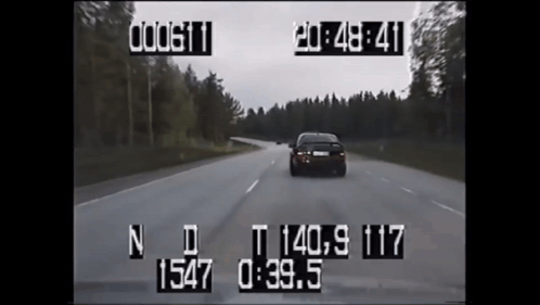 A Car Is Driving Down A Road With A Time Stamp Of 19:48 GIF