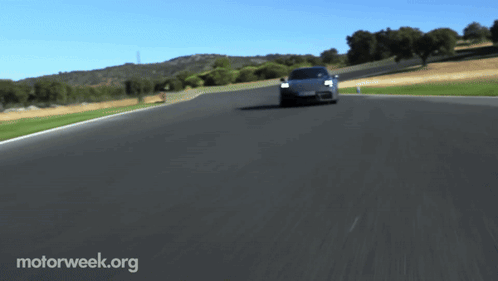 A Car Is Driving Down A Road With Motorweek.org Written On The Bottom Right GIF