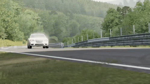 A Car Is Driving Down A Road With Trees On The Side GIF