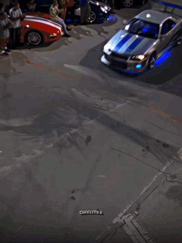 A Car Is Driving Down A Street In Front Of A Miami Sign GIF