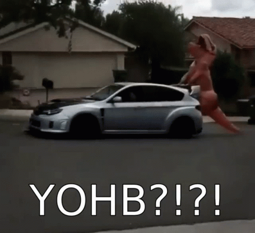 A Car Is Driving Down A Street With The Words Yohb Written On The Bottom GIF
