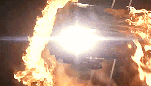 A Car Is On Fire With A Bright Light Coming Out Of The Hood GIF